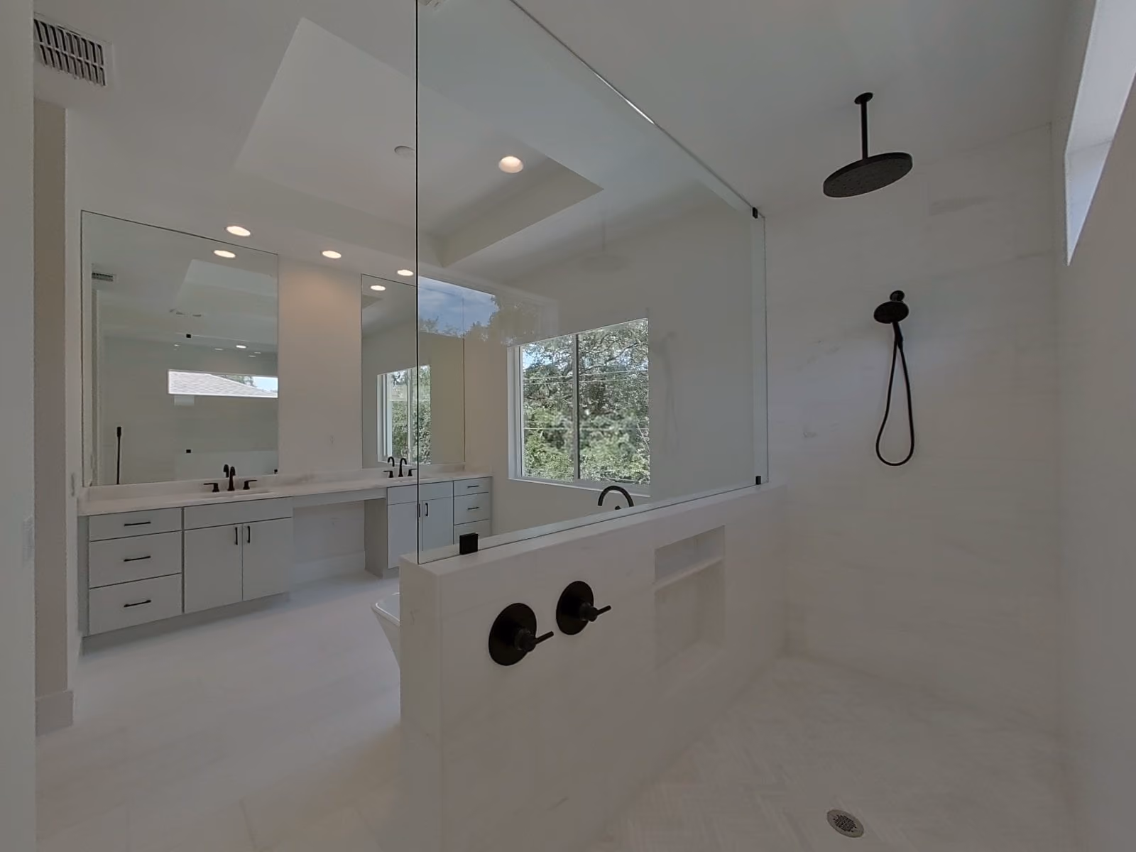 Bathroom with a glass shower and a double vanity