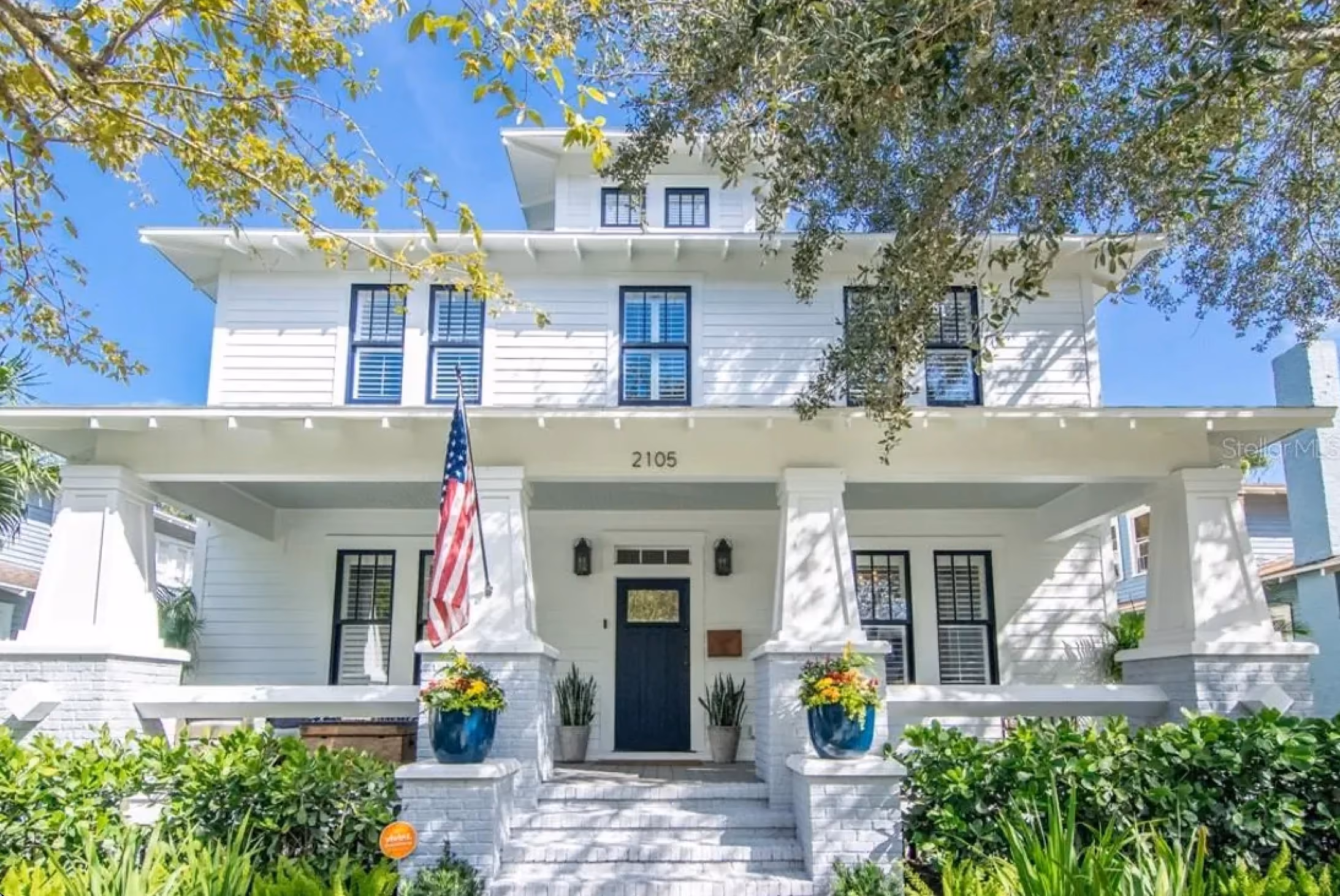 Two-story white home with a wide front porch